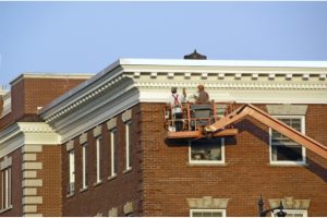 Commercial Painters on fork lift machine